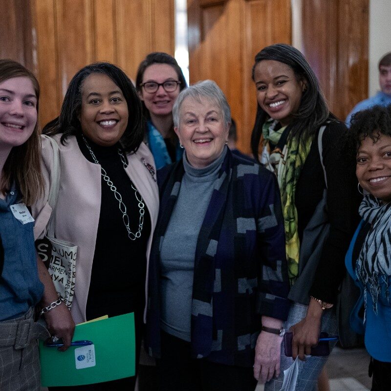 a smiling group of ladies