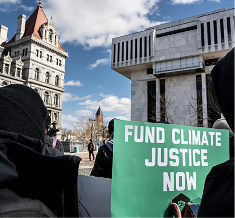 protesters outside with a green 